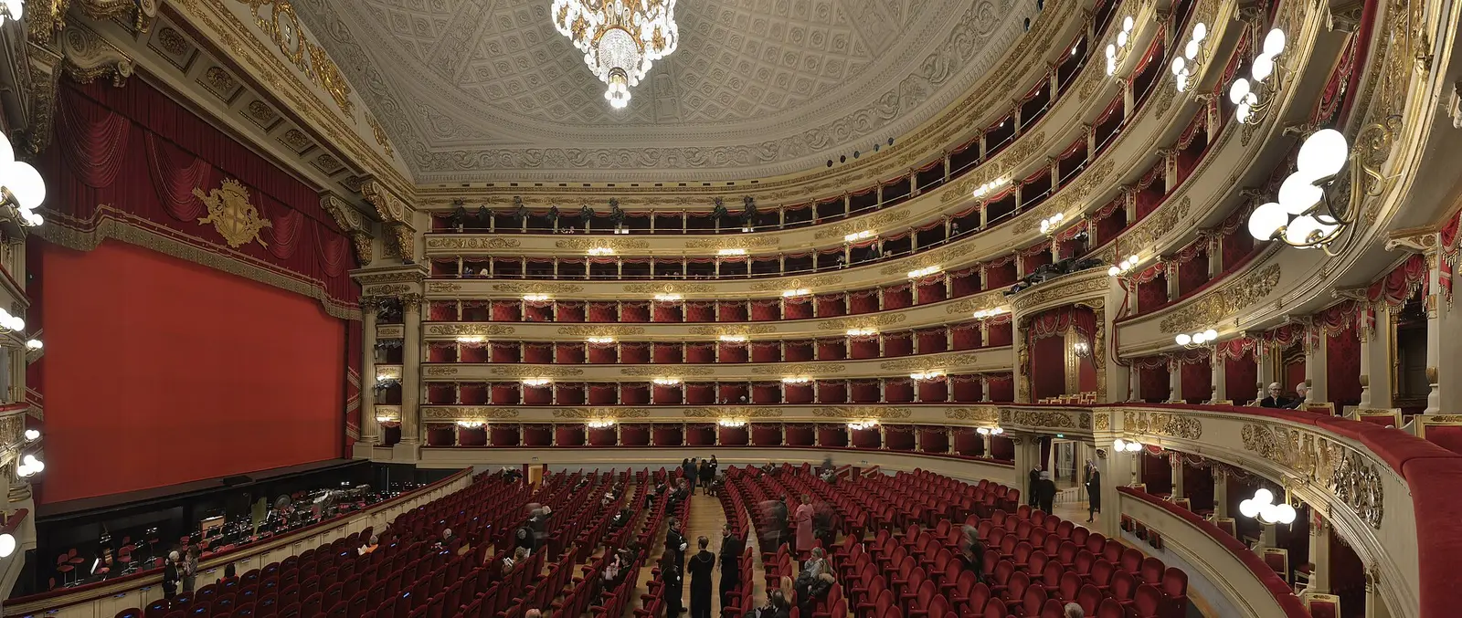 The red and gold auditorium of Teatro alla Scala in Milan seen from the stalls