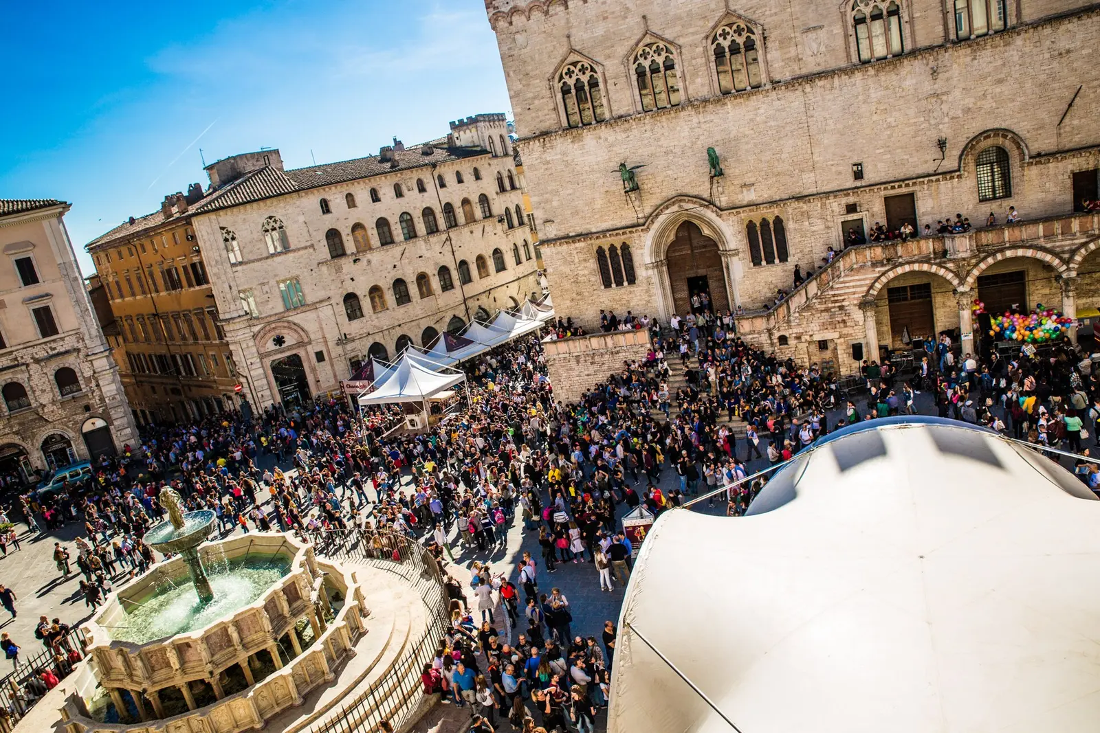 A dense crowd at Eurochocolate in Piazza IV Novembre in Perugia beside the Fontana Maggiore in 2017