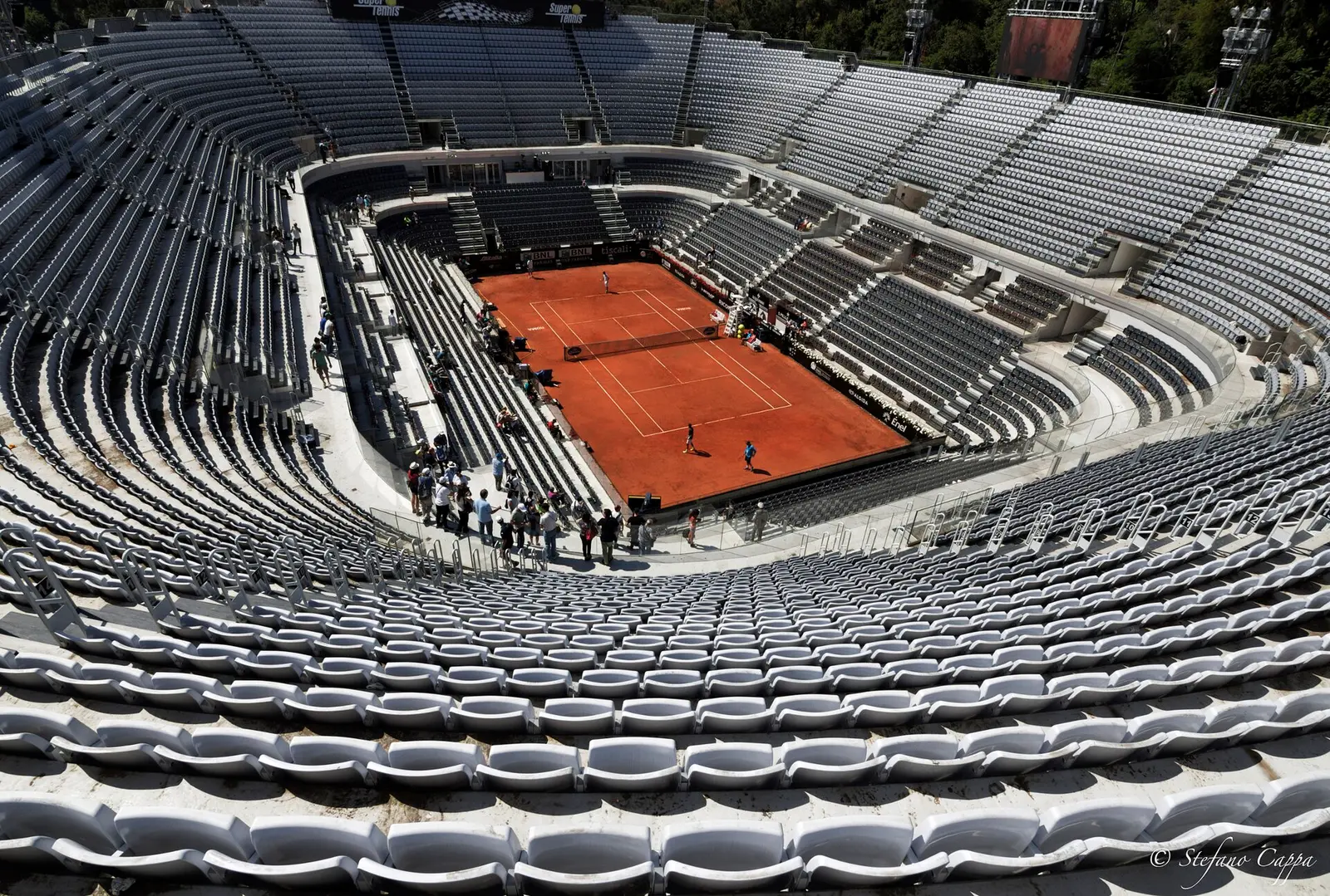 The Centrale tennis stadium at the Foro Italico in Rome seen from the top tier, with the red clay court below
