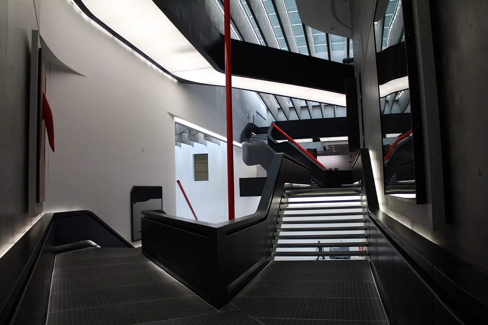 The black stairways and red column inside the MAXXI museum in Rome
