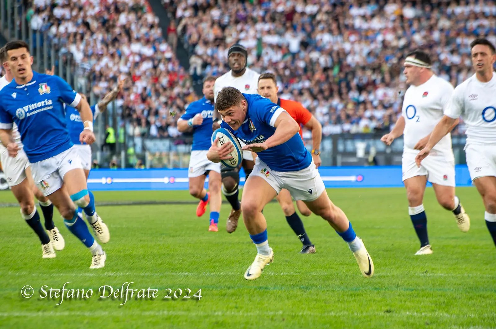 Italy in blue break against England in a Six Nations match at the Stadio Olimpico in Rome