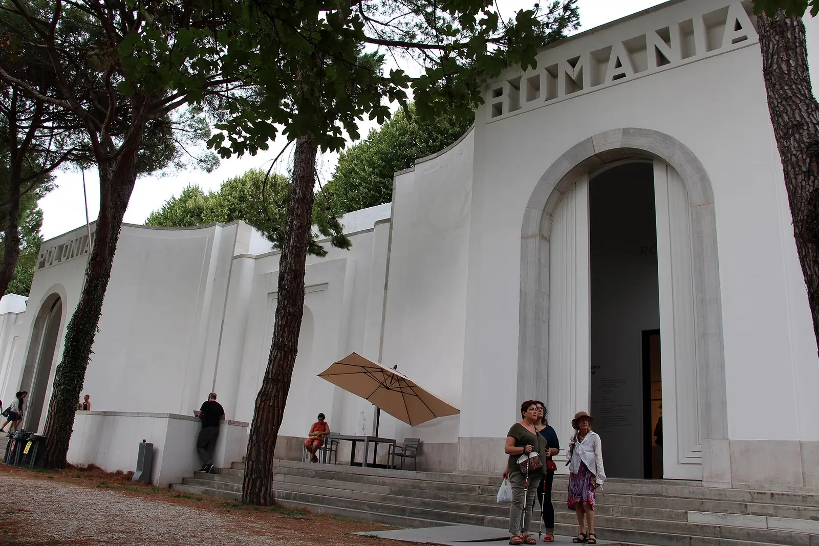 Visitors outside a white national pavilion in the Giardini during the 2017 Venice Biennale
